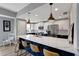 Modern kitchen boasts two-tone cabinets, stainless steel appliances, and a large island with seating at 501 Haben Blvd # 506, Palmetto, FL 34221