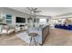 Open-concept living room flows into the kitchen with bar seating and modern decor at 501 Haben Blvd # 506, Palmetto, FL 34221