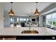 Bright condo living room boasts marble countertops and open floor plan, with views from windows and balcony at 501 Haben Blvd # 506, Palmetto, FL 34221
