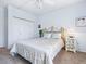 Bedroom features a decorative bed, closet, and large window at 5420 Eagles Point Cir # 106, Sarasota, FL 34231