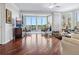 Bright living room with expansive windows, plush seating, and scenic views at 5420 Eagles Point Cir # 106, Sarasota, FL 34231