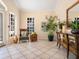 Welcoming lobby area with comfortable seating, tiled floor, and tasteful decor at 5420 Eagles Point Cir # 106, Sarasota, FL 34231