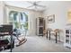 Bright office with a large window offering a lovely view and modern ceiling fan at 5420 Eagles Point Cir # 106, Sarasota, FL 34231