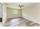 Light-filled bedroom with stylish flooring and a view of the outdoors at 5482 Globe Ter, North Port, FL 34286