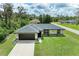 Charming single-story home with a well-manicured lawn, two-car garage, and inviting curb appeal at 5482 Globe Ter, North Port, FL 34286