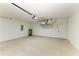 Spacious garage featuring water heater, AC unit, and utility box at 5482 Globe Ter, North Port, FL 34286