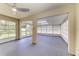 Large sunroom with floor to ceiling sliding glass windows at 5482 Globe Ter, North Port, FL 34286