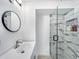 Elegant bathroom with a sleek vanity, modern fixtures, and a glass-enclosed shower with marble tiling at 55 Braden Castle Dr, Bradenton, FL 34208