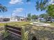 Inviting common area with a bench, fountain, landscaping and community homes at 55 Braden Castle Dr, Bradenton, FL 34208