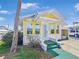 Charming home with a colorful exterior, inviting entrance, and well-maintained surroundings at 55 Braden Castle Dr, Bradenton, FL 34208