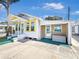 Charming home with a colorful exterior, inviting entrance, and well-maintained surroundings at 55 Braden Castle Dr, Bradenton, FL 34208