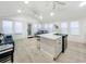 Bright and airy kitchen with stainless steel appliances, quartz countertops, and an open living space at 55 Braden Castle Dr, Bradenton, FL 34208