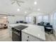 Spacious kitchen with sleek countertops, stainless steel appliances, and a large island with seating at 55 Braden Castle Dr, Bradenton, FL 34208