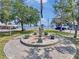 Scenic view of a community memorial with trees, landscaping, and waterfront views at 55 Braden Castle Dr, Bradenton, FL 34208