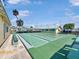 Recreational shuffleboard courts with green playing surfaces, benches, shaded covers and community buildings at 55 Braden Castle Dr, Bradenton, FL 34208