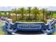 Monumental entrance sign to Lakewood National with well-manicured landscaping and water features at 5622 Arnie Loop, Lakewood Ranch, FL 34211