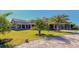 Well-manicured landscaping enhances the building's architecture, adding to its curb appeal at 5622 Arnie Loop, Lakewood Ranch, FL 34211