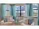 Cozy living space features ocean views, comfortable chairs and coastal decor at 5622 Arnie Loop, Lakewood Ranch, FL 34211