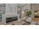 Stylish lounge area with a modern fireplace, accent wall, and cozy seating, perfect for entertaining guests at 5622 Arnie Loop, Lakewood Ranch, FL 34211