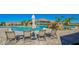 Resort-style community pool with waterfalls, poolside seating, and lush landscaping for ultimate relaxation at 5622 Arnie Loop, Lakewood Ranch, FL 34211