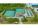 Aerial view of tennis courts, bocce ball, and covered seating at Lakewood National community at 5622 Arnie Loop, Lakewood Ranch, FL 34211