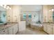 Elegant bathroom with dual vanities, soaking tub and separate shower at 5622 Arnie Loop, Lakewood Ranch, FL 34211