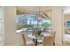 Breakfast nook offers serene views of screened lanai, pool and water at 5622 Arnie Loop, Lakewood Ranch, FL 34211
