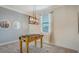 Bright game room offers modern light fixture, matching mirrors and a foosball table on patterned rug at 5622 Arnie Loop, Lakewood Ranch, FL 34211