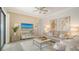 Comfortable living room featuring tile flooring, a ceiling fan, and stylish decor at 5622 Arnie Loop, Lakewood Ranch, FL 34211