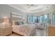 Charming main bedroom features large windows, tray ceiling and an ensuite bath at 5622 Arnie Loop, Lakewood Ranch, FL 34211