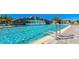 Gorgeous waterfall feature flowing into the resort-style pool, enhancing the community's luxurious ambiance at 5622 Arnie Loop, Lakewood Ranch, FL 34211