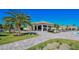 Relaxing poolside bar area, surrounded by lush landscaping, perfect for enjoying drinks and socializing at 5622 Arnie Loop, Lakewood Ranch, FL 34211