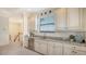 Modern wet bar featuring granite countertop, stainless fridge and white cabinetry in spacious upstairs area at 5622 Arnie Loop, Lakewood Ranch, FL 34211