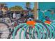 A row of bicycles securely parked in a blue public bike rack at 5718 Title Row Dr, Bradenton, FL 34210