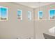 Bright foyer with modern lighting and multiple windows providing plenty of natural light at 5718 Title Row Dr, Bradenton, FL 34210