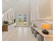 Bright and airy foyer with high ceilings, stylish decor, and an inviting atmosphere at 5718 Title Row Dr, Bradenton, FL 34210