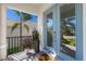 Welcoming front porch featuring a stylish blue door and views of the landscaped front yard at 5718 Title Row Dr, Bradenton, FL 34210