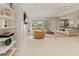 Spacious living room boasts natural light, modern furniture, and seamless access to outdoor living spaces at 5718 Title Row Dr, Bradenton, FL 34210