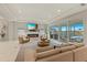 Bright living room with a fireplace, comfortable seating, and sliding glass doors that open to an outdoor area at 5718 Title Row Dr, Bradenton, FL 34210
