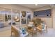Comfortable outdoor patio with wicker furniture, grill, and sliding glass doors at 5718 Title Row Dr, Bradenton, FL 34210