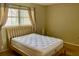 Comfortable bedroom featuring a bed, window, and neutral decor at 6110 Coral Way, Bradenton, FL 34207