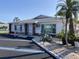 Exterior view of community building with well-maintained landscaping and a ramp for accessibility at 6110 Coral Way, Bradenton, FL 34207