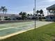 Shuffleboard courts in a community setting, surrounded by landscaping and parking at 6110 Coral Way, Bradenton, FL 34207