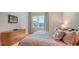Bedroom with natural light, light-colored decor and a view of the community at 612 Mourning Dove Dr, Sarasota, FL 34236