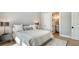 Comfortable bedroom with ensuite bath access features soft textures and a gray palette at 612 Mourning Dove Dr, Sarasota, FL 34236