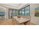 Open dining area with backyard views and comfortable seating for eight at 612 Mourning Dove Dr, Sarasota, FL 34236