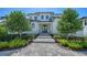 Elegant home entrance with a stone walkway and well-maintained landscaping at 612 Mourning Dove Dr, Sarasota, FL 34236