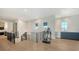Second floor hallway with access to the laundry room, workout room and beverage center at 612 Mourning Dove Dr, Sarasota, FL 34236