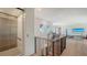 Second floor hallway with an elevator and a workout area at 612 Mourning Dove Dr, Sarasota, FL 34236