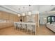 Gourmet kitchen with island seating, pendant lighting, and stainless steel appliances at 612 Mourning Dove Dr, Sarasota, FL 34236